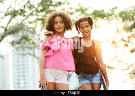 Best friends spending free time in park Stock Photo