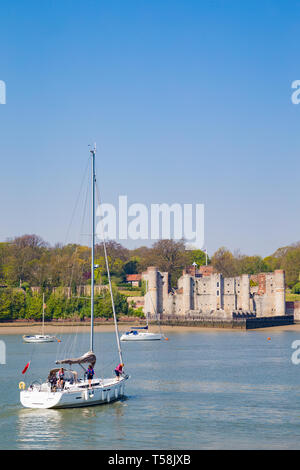 Upnor, Rochester, Kent, UK. A yacht leaves Chatham Marina and sails into the River Medway and past Upnor Castle.