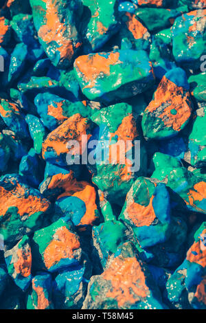 stones with different paint lie on the surface, a top view Stock Photo