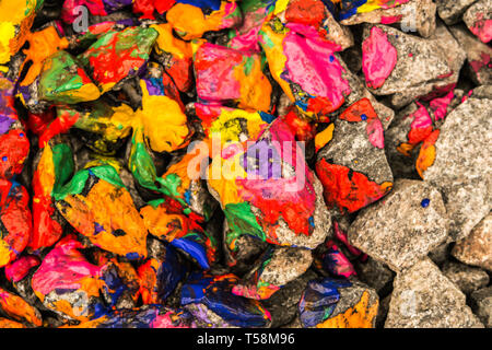 Pebbles painted bright motley paint color closeup Stock Photo