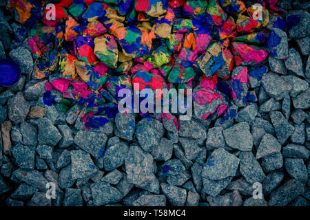 background dark gray stones and rocks in colorful neon colors, view from above Stock Photo