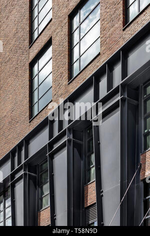 Detail of steel columns and brickwork at the base. Henry Hall, New York, United States. Architect: BKSK Architects, 2018. Stock Photo
