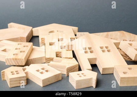Many felled wooden houses. Destruction of houses as a result of natural disaster. The flood. Hurricane. Fire. Danger. Emergency housing. Reconstructio Stock Photo