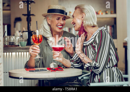 Delighted nice women having a pleasant conversation Stock Photo