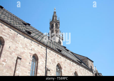 The tower of  the Duomo Dom Maria Himmelfahrt from Piazza Walther von de Vogelweide Bolzano Dolomites South Tyrol Italy Stock Photo