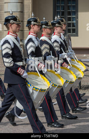 Drummers of the Royal Swedish Army Band in dark blue full dress uniforms and black pickelhaube helmets parading during the changing of the guard. Stock Photo