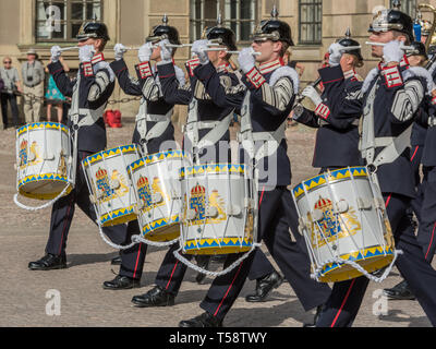 Drummers of the Royal Swedish Army band in dark blue full dress uniforms and black pickelhaube helmets parading during the changing of the guard. Stock Photo