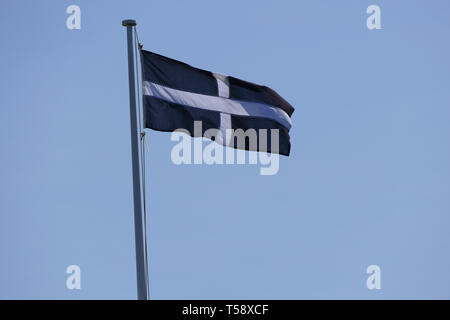 Cornish flag against a blue sky Stock Photo