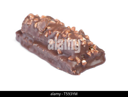 Small chocolate covered cake with crushed nuts isolated on white background Stock Photo