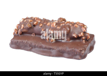 Small chocolate covered cake with crushed nuts isolated on white background Stock Photo