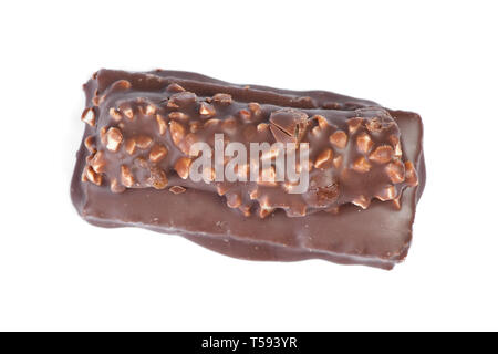 Small chocolate covered cake with crushed nuts isolated on white background Stock Photo