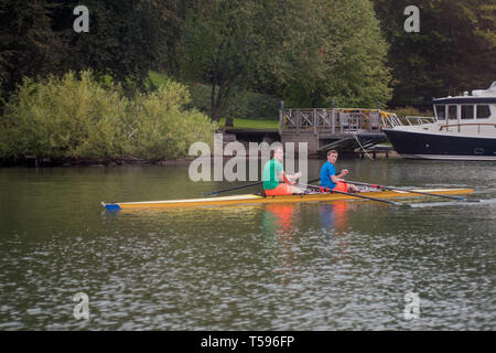 Two young rowers in a double scull shell on the Djurgårdsbrunnskanalen (Djurgården Well Canal) in Stockholm. Stock Photo