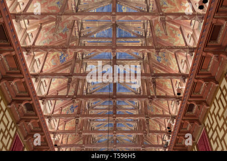 The elaborately painted wooden ceiling of the City Council chamber in Stockholm City Hall.The ceiling was built in the style of a Viking longhouse. Stock Photo