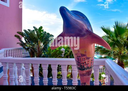 St. Pete Beach, Florida. January 25, 2019. Top view of colorful dolphin statue on balcony of The Don Cesar Hotel. The Legendary Pink Palace of St. Pet Stock Photo