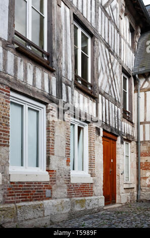 old house, half-timbered, red brick, cobblestone street, Caudebec-en-Caux; France; Normandy; summer, vertical Stock Photo