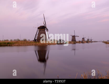 Windmills in Kinderdijk at dusk, The Netherlands Stock Photo