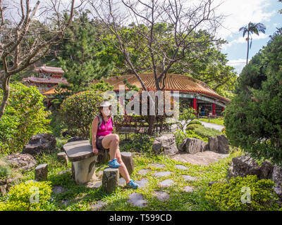 Maokong, Taiwan - October 19, 2016: Women with racksack in the park of  the Chih Nan Temple on the hills of Maokong  in Taiwan. Asia Stock Photo