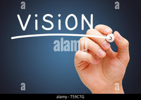 Hand writing the word Vision with white marker on transparent wipe board over dark blue background. Stock Photo