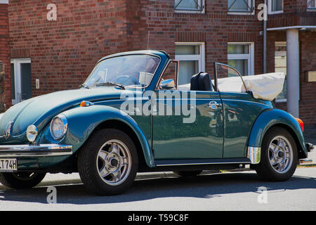 Mainz, Germany - April 19, 2019: blue classic convertible VW Beetle car parking in Mainz on a sunny day. Stock Photo