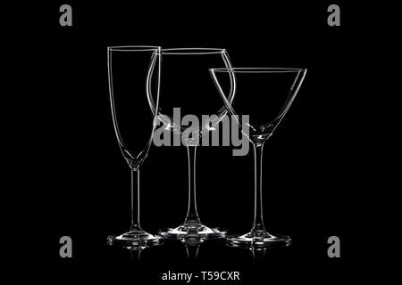 Empty cocktail glassware on a black background. Stock Photo