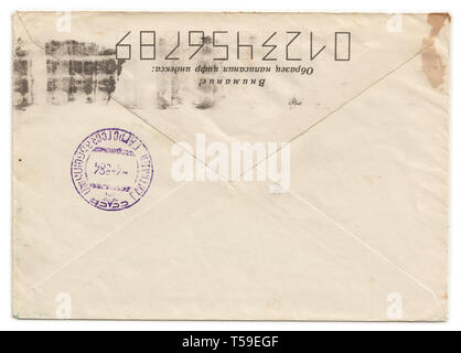 Grunge old envelope with meter stamp isolated n white background Stock Photo