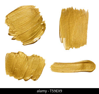 Gold paint stokes isolated on white background Stock Photo