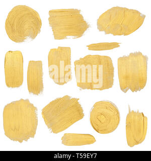 Gold paint stokes set isolated on white background Stock Photo