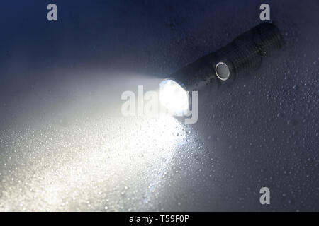 Tactical flashlight Stock Photo