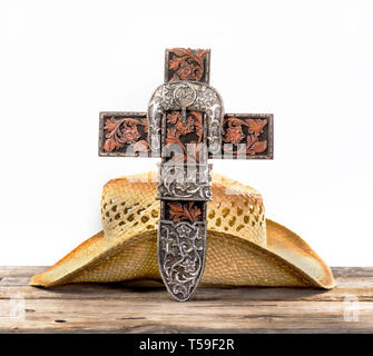 Cowboy prayer cross and old stray hat . Stock Photo