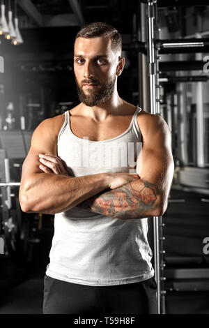 Bodybuilding. Bearded man standing at gym crossed arms confident Stock Photo