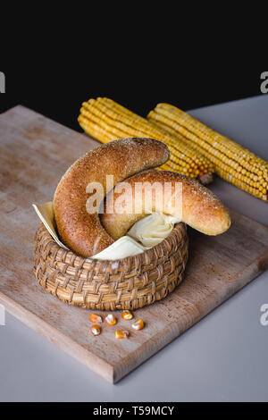 Fresh corn rolls in a wooden basket Stock Photo