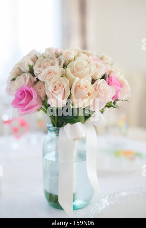 Delicate pink roses on beige background. Word LOVE made of rope ...