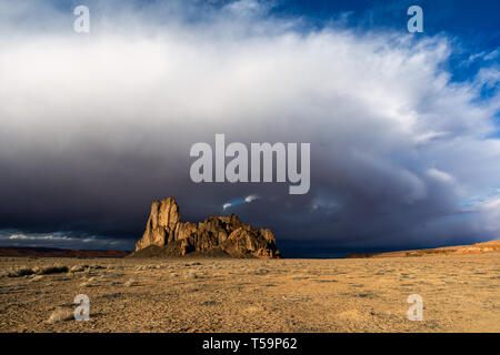Scenic western desert landscape with dramatic clouds and sky in over volcanic rock formations in Monument Valley, Arizona, USA Stock Photo