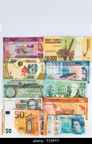 Banknotes background with currency from Guernsey, Madagascar, Croatia, UK, Sri Lanka  and Europe with copy space. Stock Photo