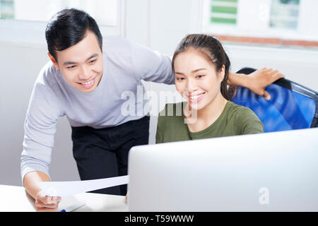Young computer designers testing app Stock Photo