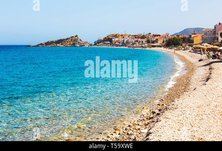 Samos island, Greece - September 12, 2017: Beautiful Kokkari beach, tourists enjoying a nice summer day on Samos Island in Greece Stock Photo