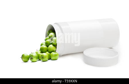 Swap  your pills to a fresh green apples. Concept of nature made vitamin supplement from natural fruits Stock Photo