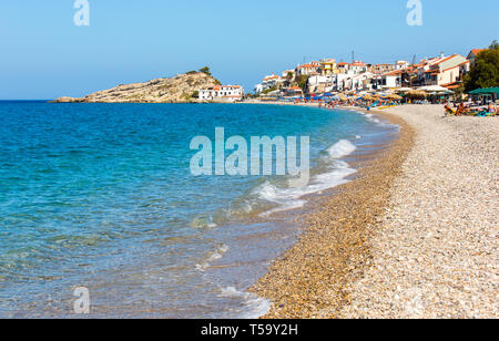 Samos island, Greece - September 12, 2017: Beautiful Kokkari beach, tourists enjoying a nice summer day on Samos Island in Greece Stock Photo