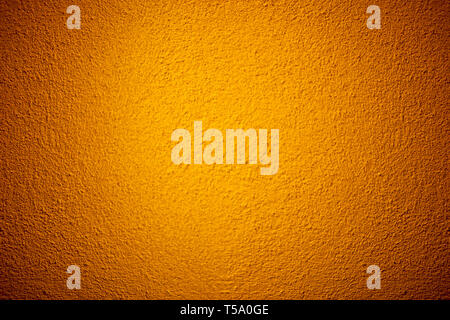 Orange color grunge cement wall texture background Stock Photo