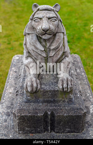 Small stone lion statue in the Stanley Park close to the Lions Gate Bridge in Vancouver, British Columbia, Canada Stock Photo