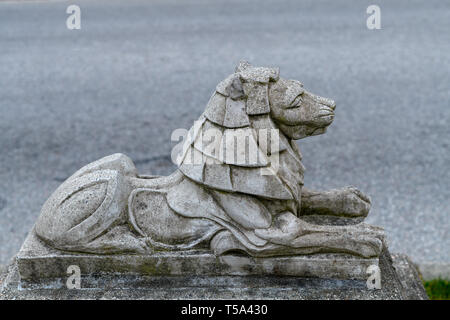 Small stone lion statue in the Stanley Park close to the Lions Gate Bridge in Vancouver, British Columbia, Canada Stock Photo