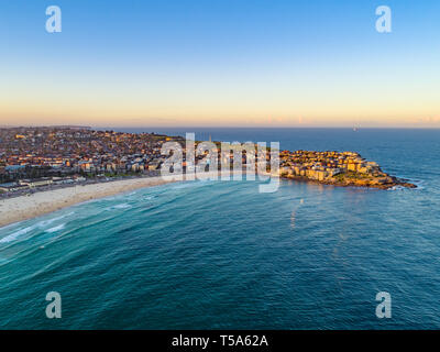 Bondi Beach Drone Shot at Sunset with Sydney CBD in background at Sunset