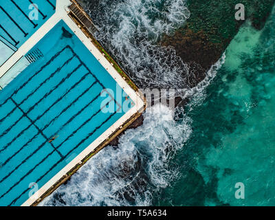 Aerial Drone shot of Waves crashing on to Bondi Icebergs Rockpool Stock Photo