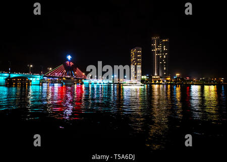 Han River Bridge and the Thuan Phuoc Bridge at night flamboyance on the Han River. Night view of Danang. Vietnam. Stock Photo