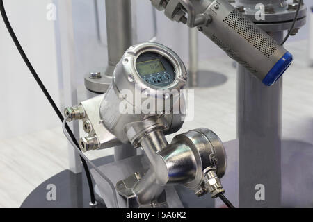 Mortise ultrasonic flow meter to measure the flow of liquids and heat metering. Oil and gas processing plants, chemical and petrochemical industries. Stock Photo