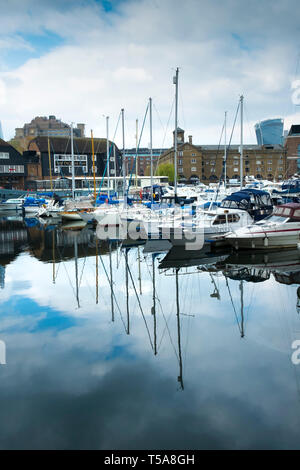 Boats moored in St Katherine Dock St Katherines Dock in Wapping in London. Stock Photo