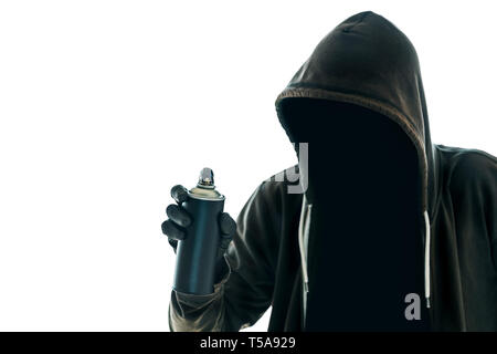 Hooded graffiti artist with spray paint can isolated on white ...