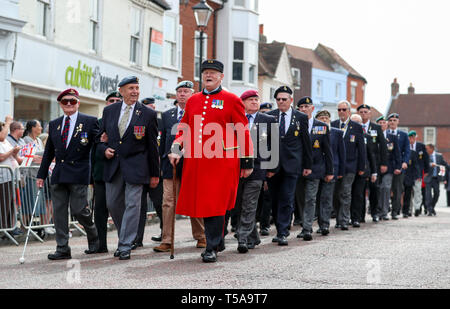 Veterans march along the high street, as they take part in the annual St George's day parade in Emsworth, Hampshire. Stock Photo