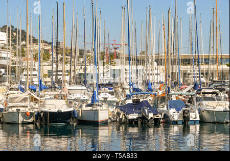 CANNES, FRANCE - APRIL 2019: Sailing boats moored close together in the harbour in Cannes. Stock Photo