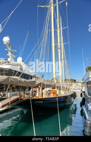 CANNES, FRANCE - APRIL 2019: Sailing ship with tall masts tied up in the harbour in Cannes. Stock Photo
